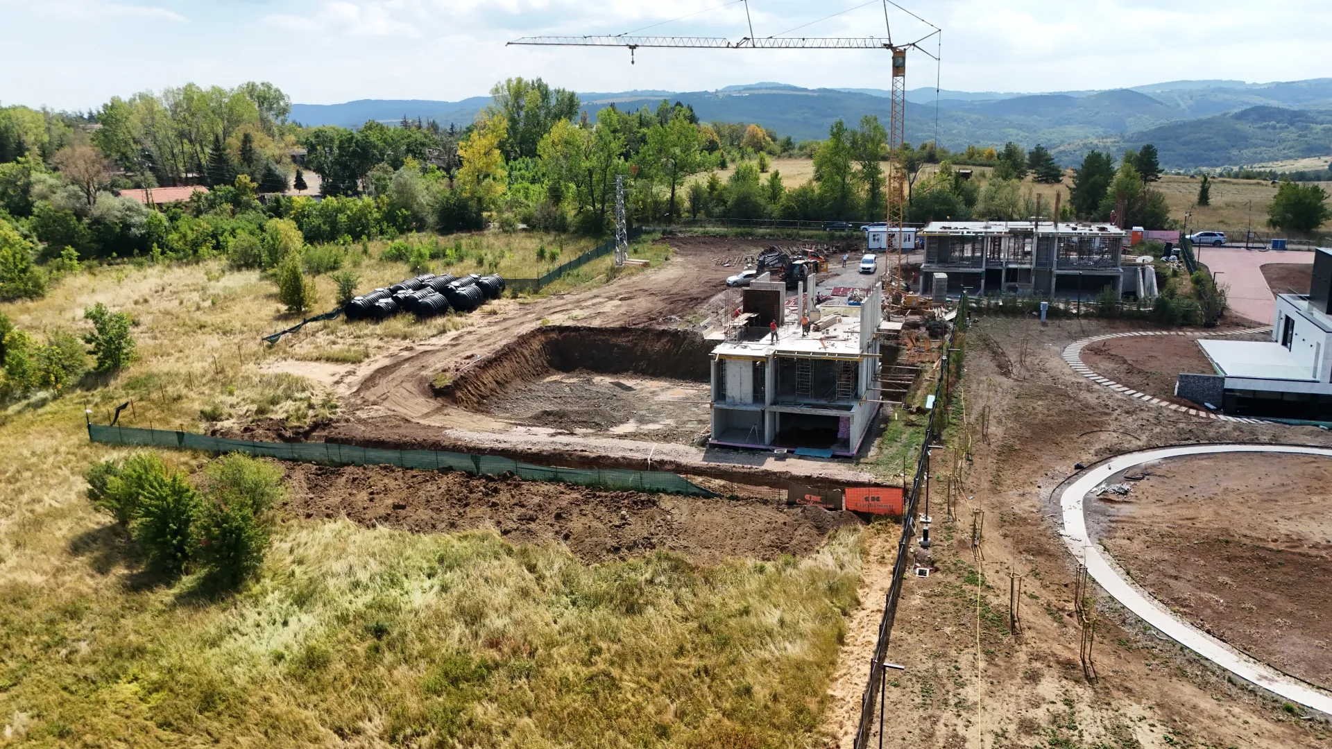 From north to south: house 3 in the middle, house 2 behind it, and to the right the garden of the finished first house.